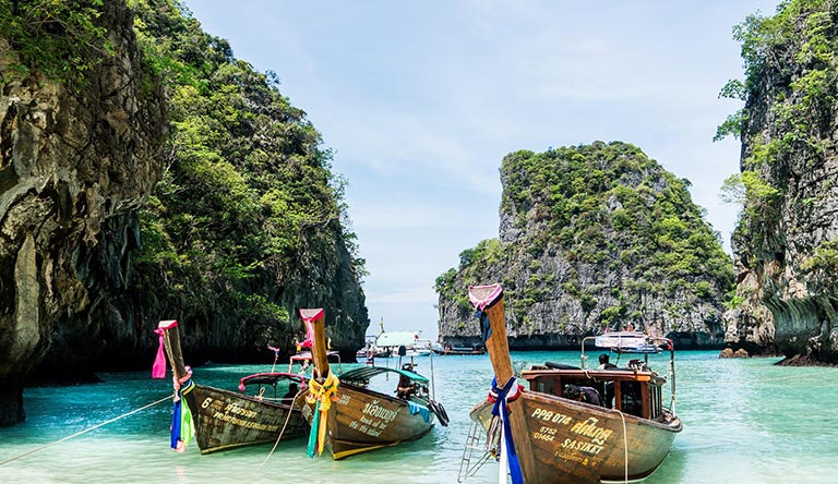 traditional-boats-on-the-beach-phuket-thailand.jpg